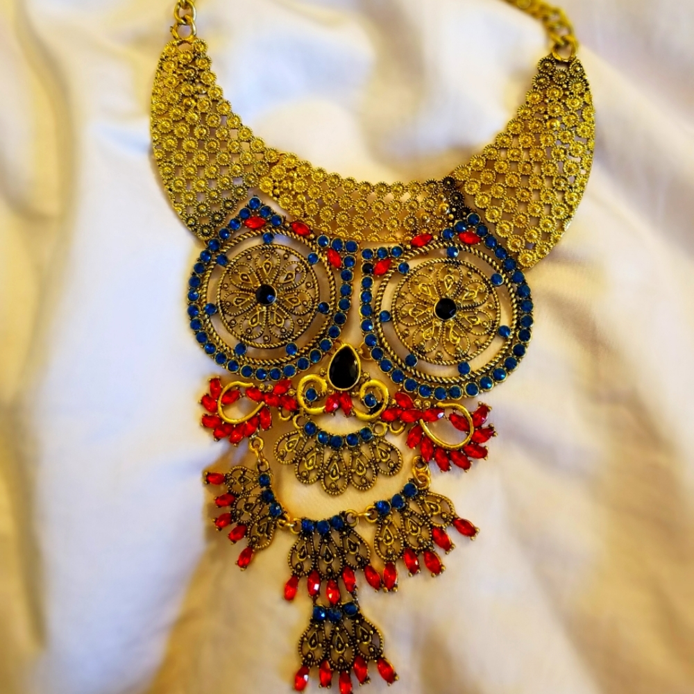 Beautiful large owl necklace. Gorgeous stones and very well made.